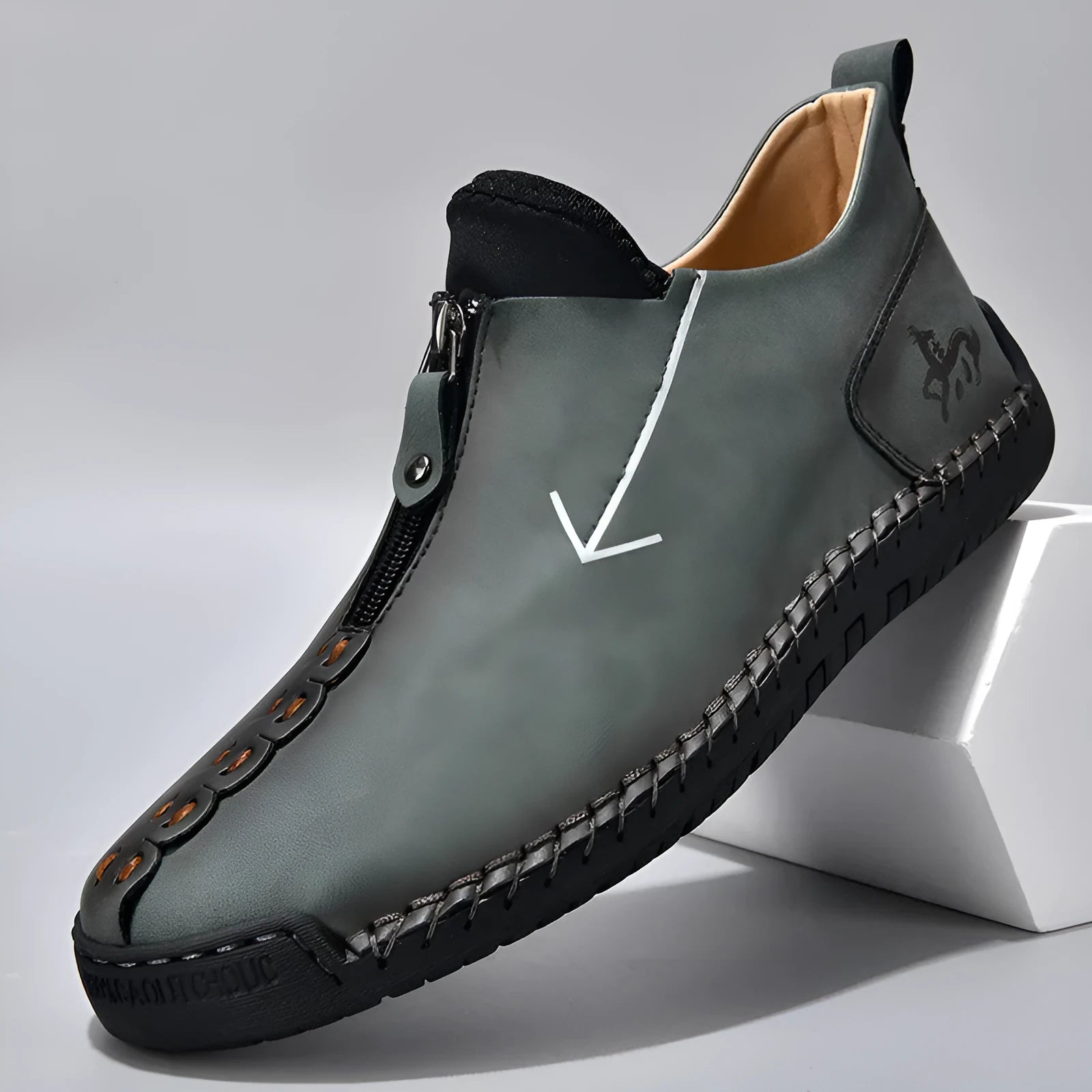 Men's black zip-up Martin boot with round toe and low heel on a white background.