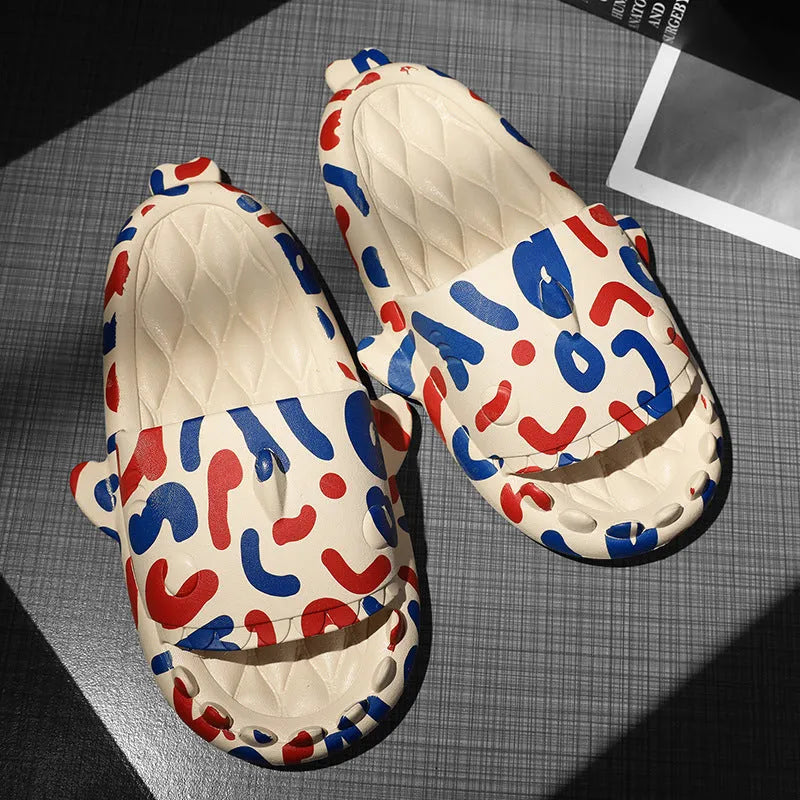 Cute shark design open toe EVA home slippers in assorted colours on a white background.