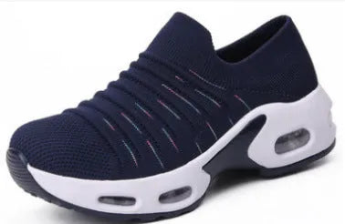 Women's plus size fly-knit socks shoes in dark blue with mesh upper and low heel, showing round toe design.