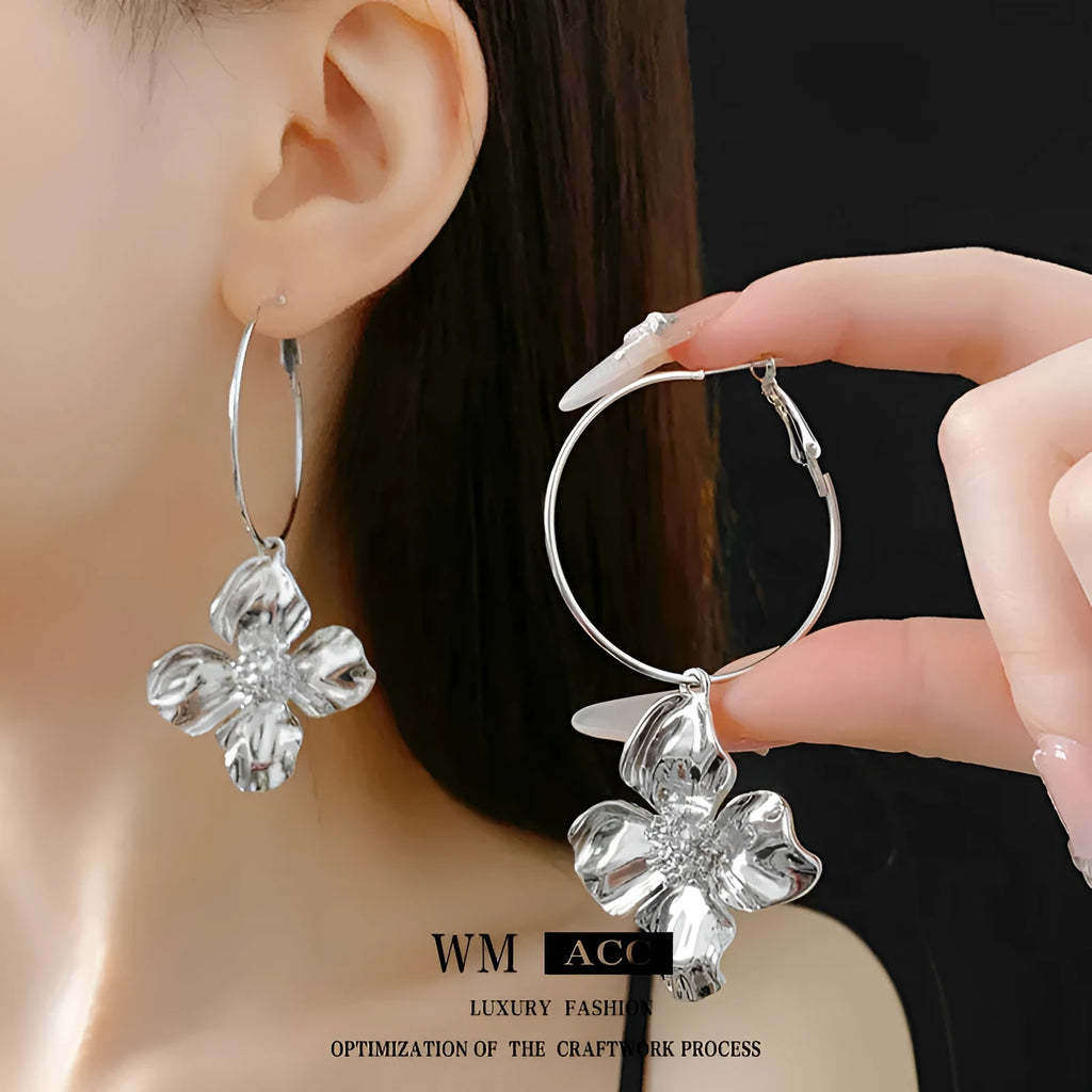 Metal flower geometric earrings with silver needle detail in gold or silver electroplated finish