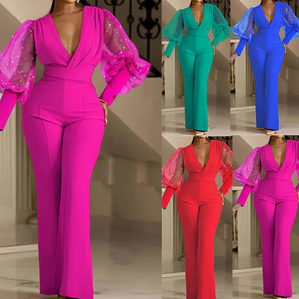 Red women's jumpsuit with mesh stitching on the torso, long sleeves, elastic waist, and wide-leg trousers.