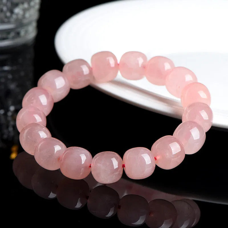 Pink barrel-shaped crystal bead bracelet with polished finish and original geometry design