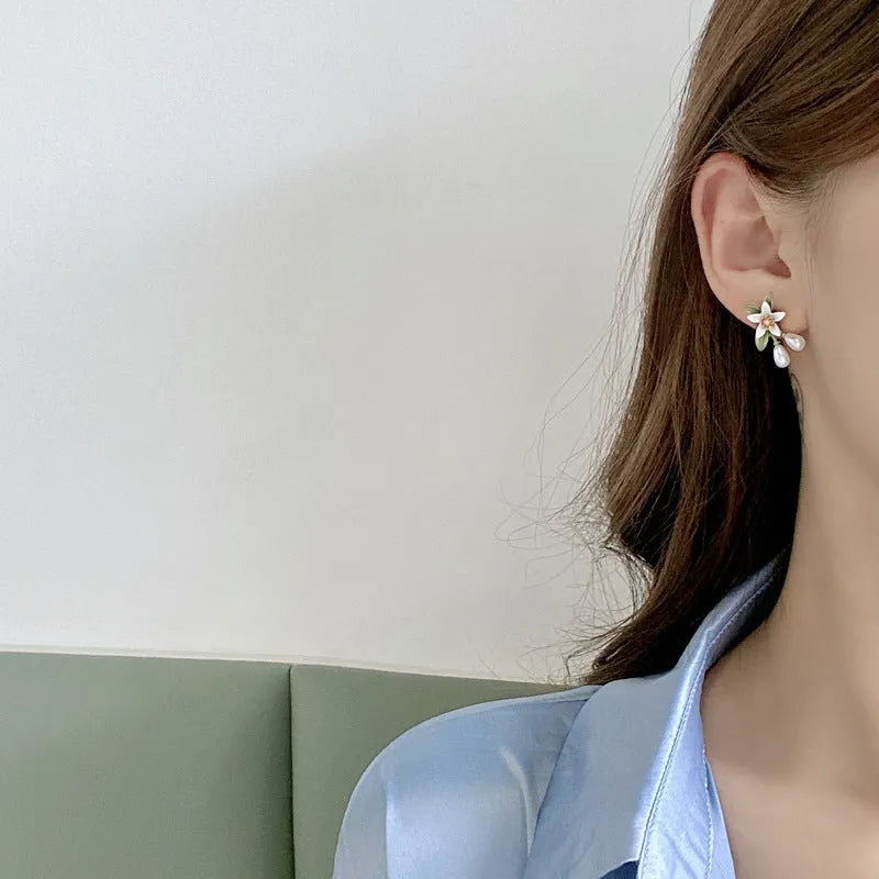 Alloy camellia flower earrings with sterling silver needle and contrasting colours including stud and clip options