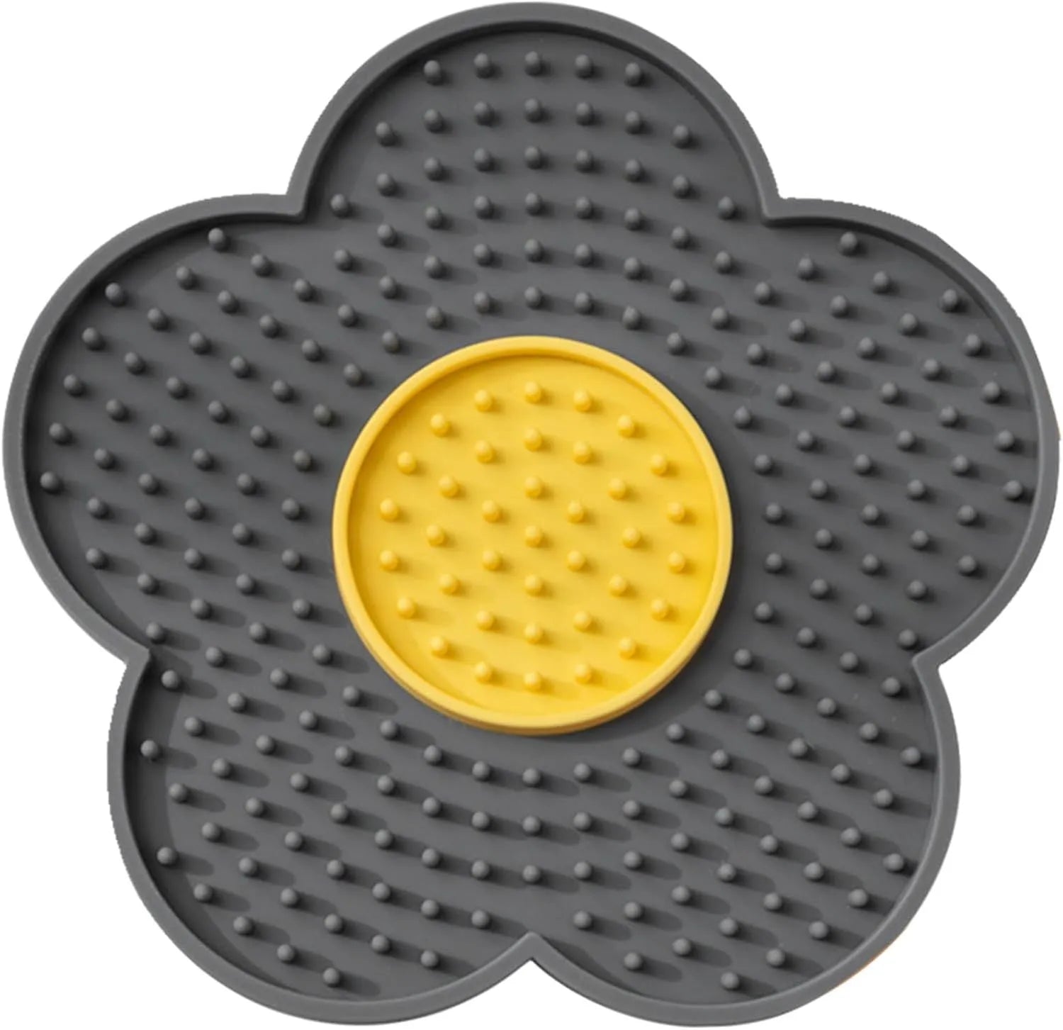 Flower-shaped blue silicone dog licking mat with suction cups on a smooth tile surface.