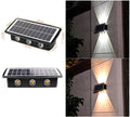 Solar outdoor wall light with 4 LED beads, ABS+PC housing, and glass polysilicon solar panel mounted on a brick wall
