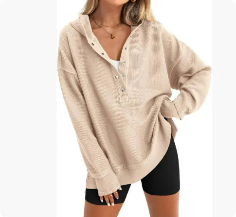 Women's loose raglan sleeve pullover sweater in peacock green colour, laid flat.
