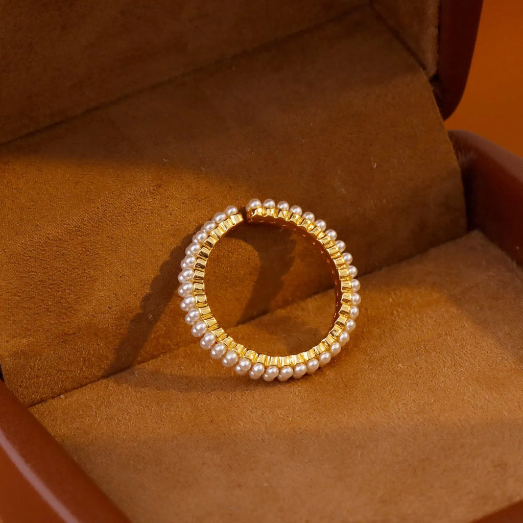 Gold electroplated open-mouth pearl women's ring with geometric design and round decorative elements