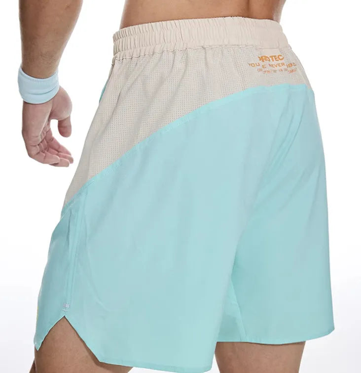 Men's loose dark grey workout shorts with an elastic and lace-up waistband for lifting.