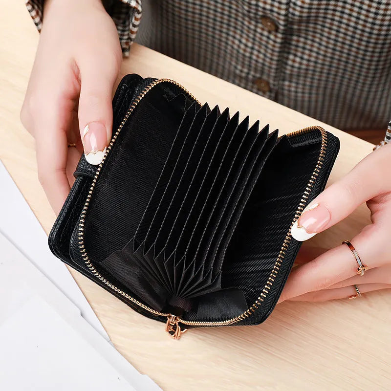 Ladies' short two-fold wallet in PU leather with a lychee pattern, shown in beige, pink, black, and red.