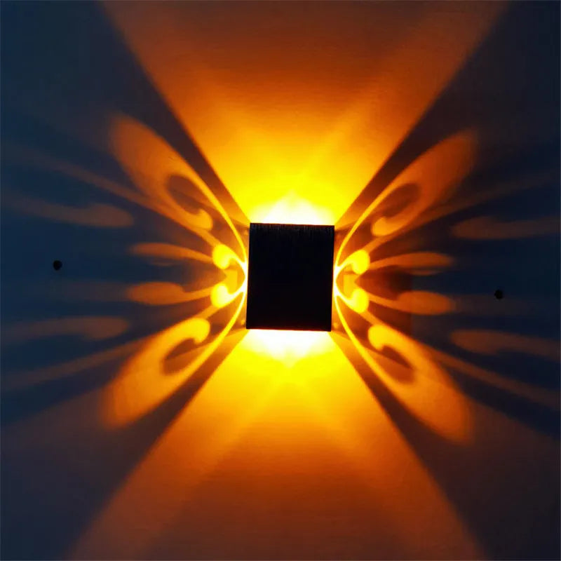 Butterfly-shaped LED wall lamp with aluminium shade in modern style
