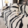 Zebra pattern non-slip flannel sofa cover with matching pillowcase in caramel colour.