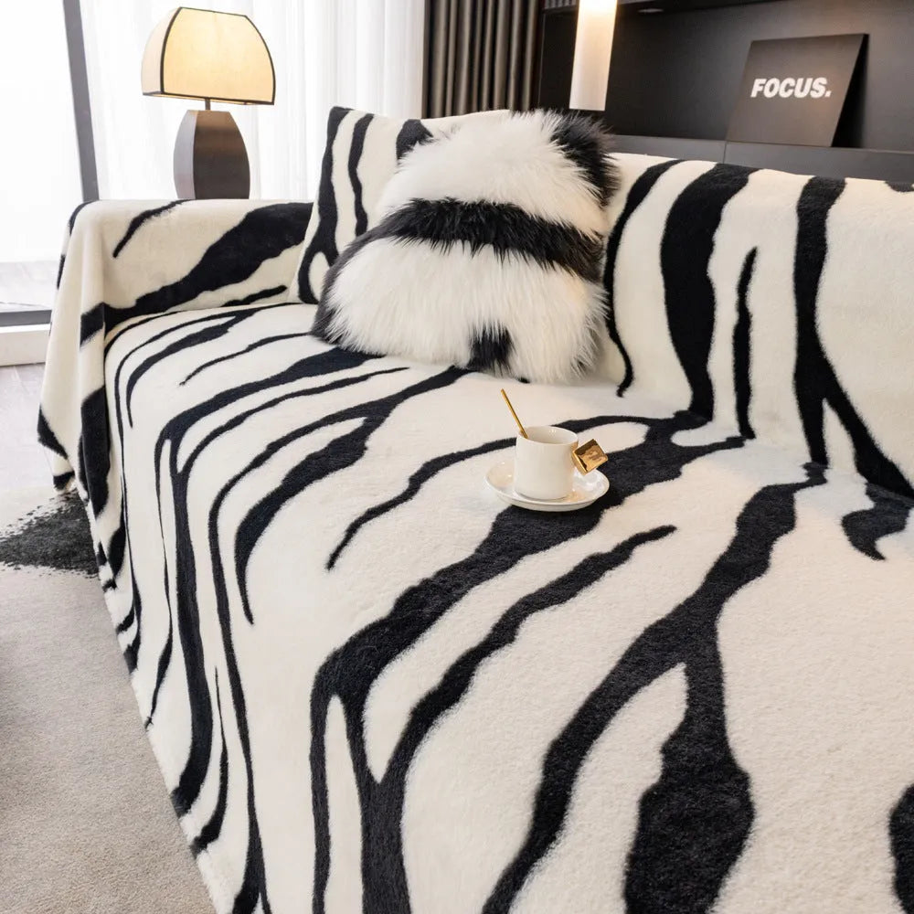 Zebra pattern non-slip flannel sofa cover with matching pillowcase in caramel colour.