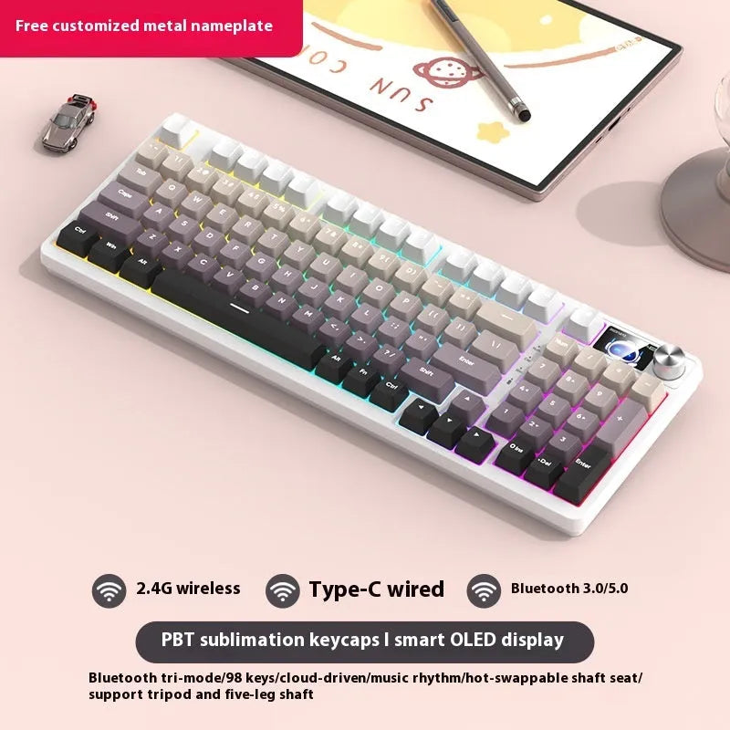 98-key wireless mechanical keyboard kit on a desk, showing white screen version with metal knob and lilac colour background.