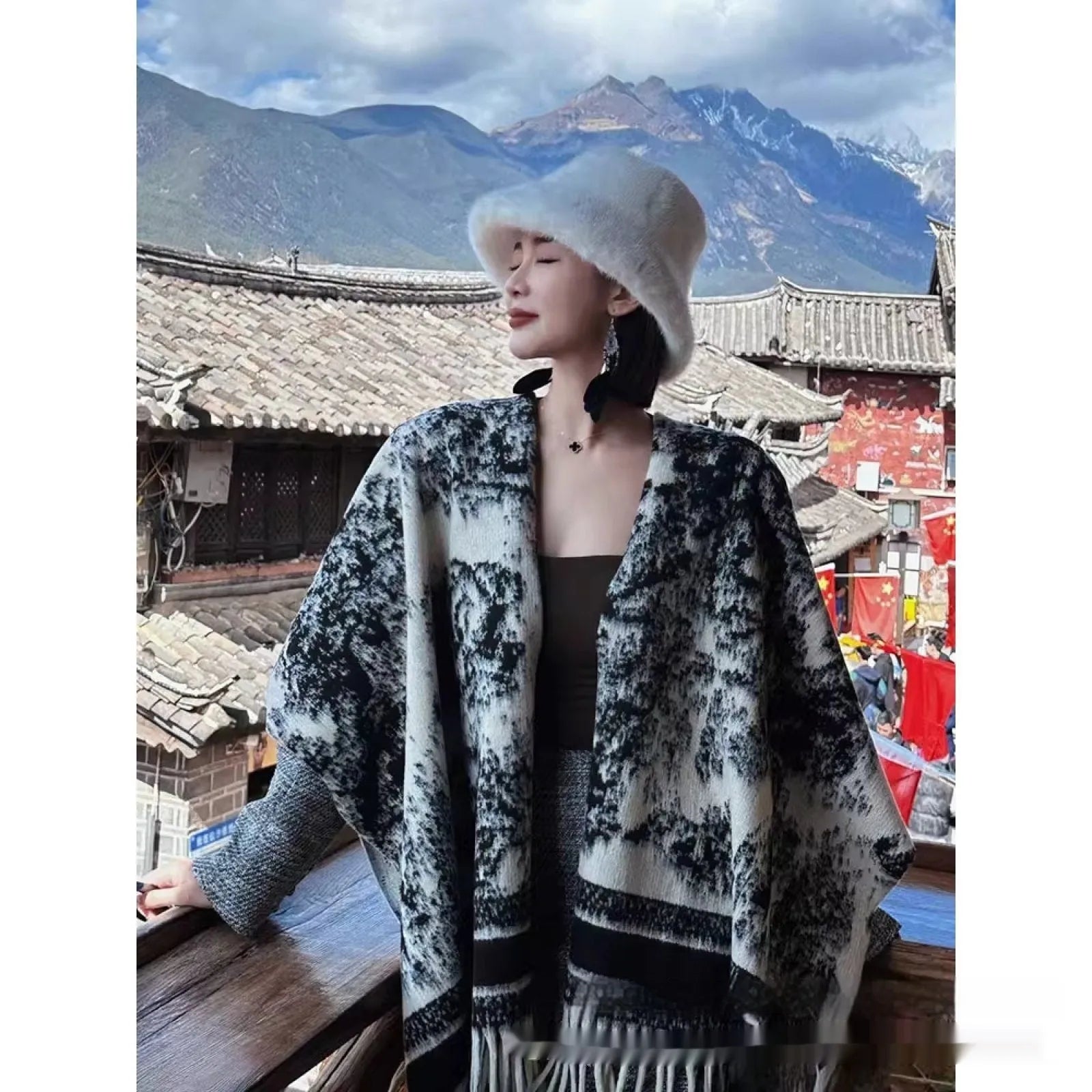 Women's polyester tassel scarf cape draped over shoulders showing fringe detailing