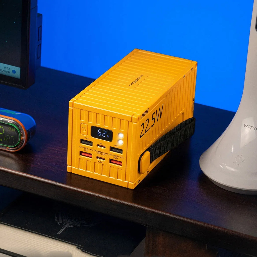 Yellow large capacity 50000mAh power bank with digital display and multiple USB output ports.