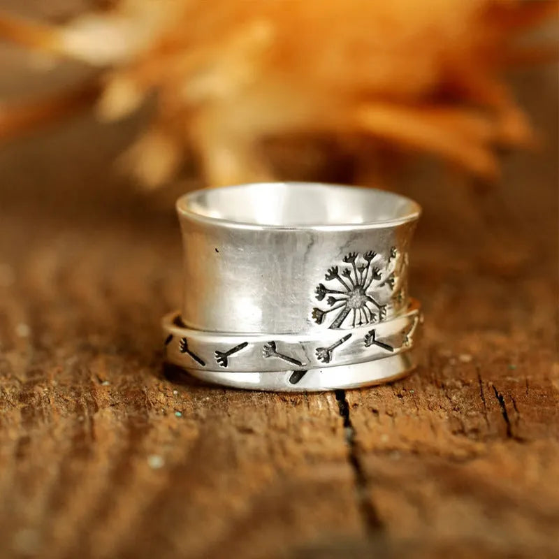 Silver rotatable flower ring with adjustable floral decoration on alloy band