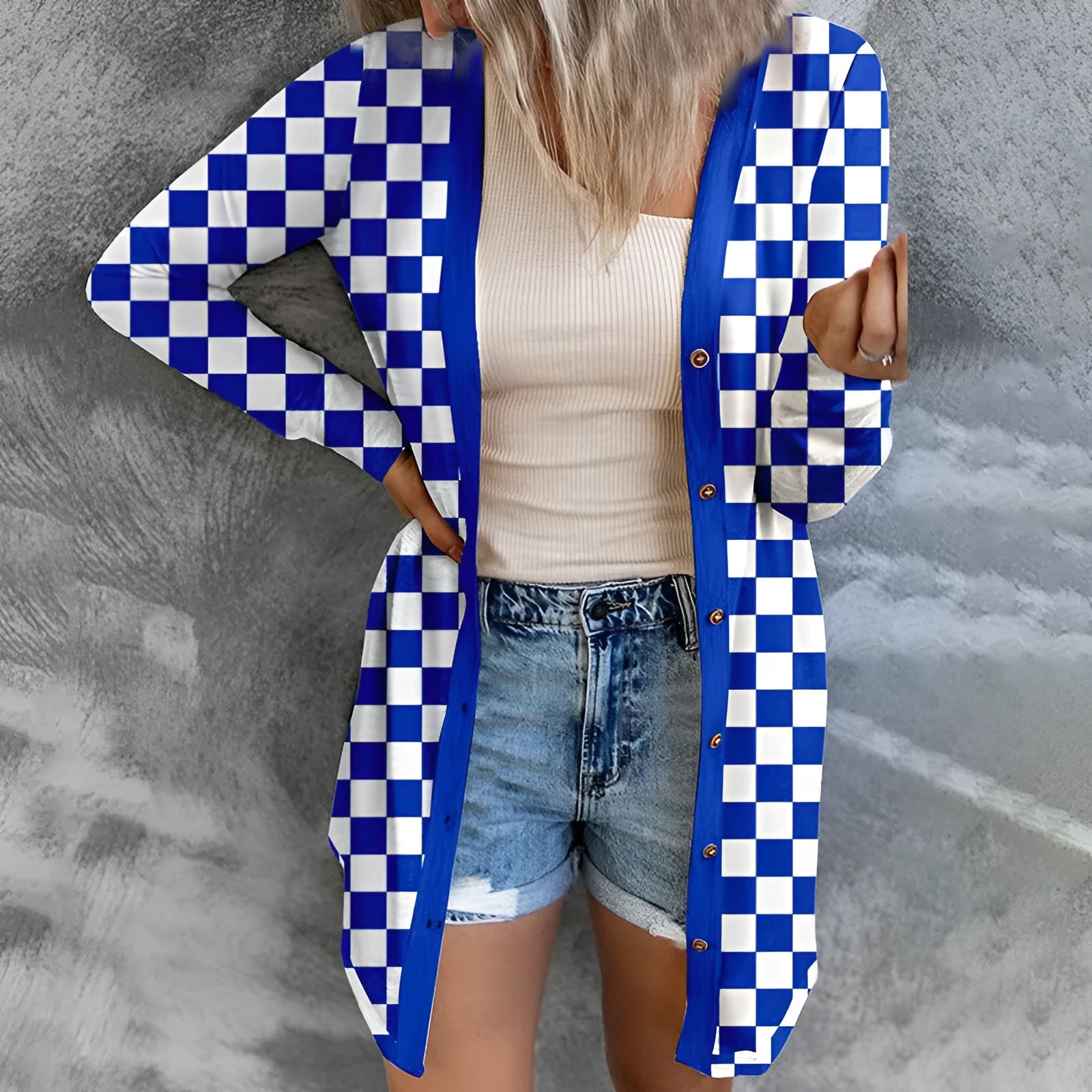 Long grey plaid knitted cardigan coat on a model, showing loose fit and regular sleeves.