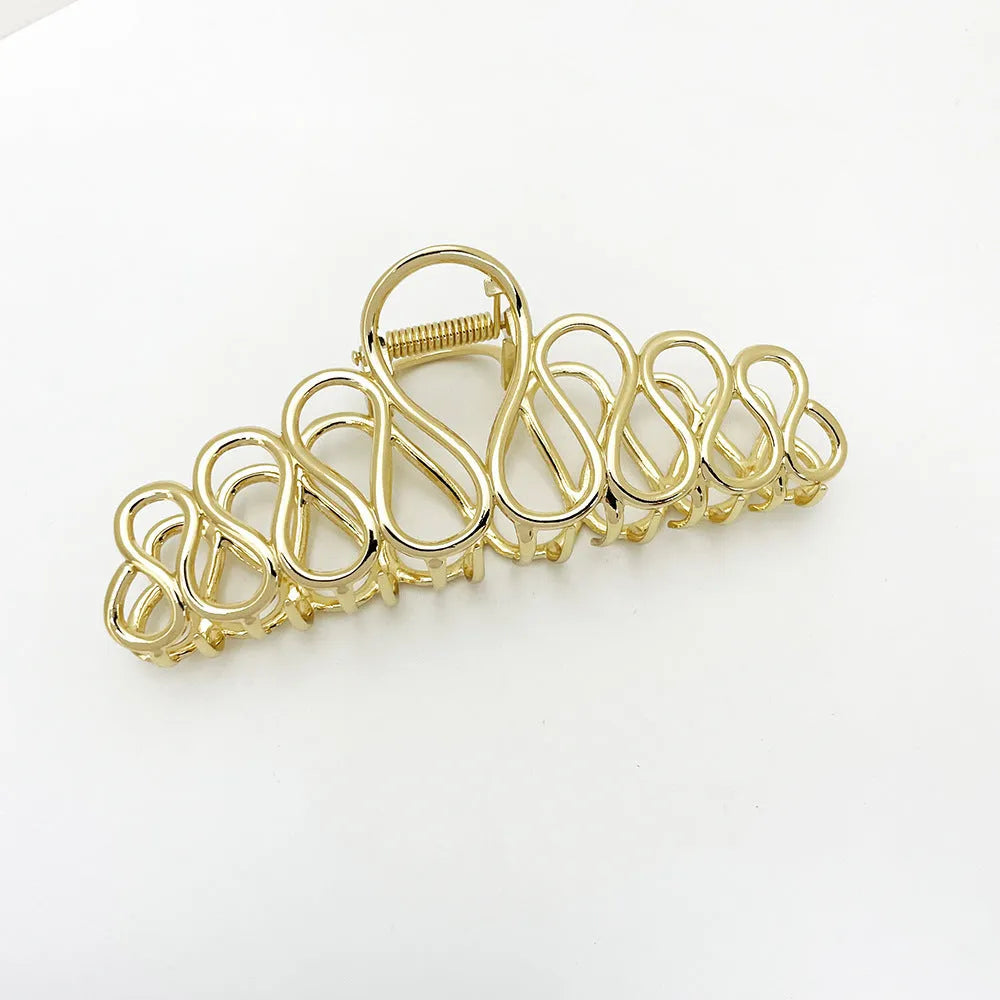 Large gold or silver alloy hair clip with minimalist design and European tassel detailing for women's updo hairstyles