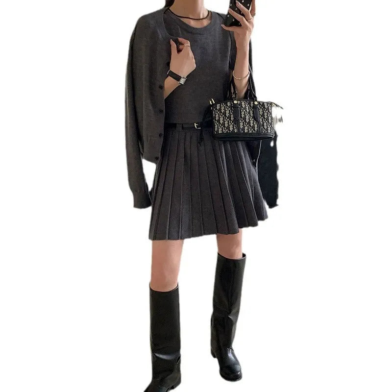 Women's grey national style knitted two-piece set with pleated vest skirt and long-sleeved cardigan.