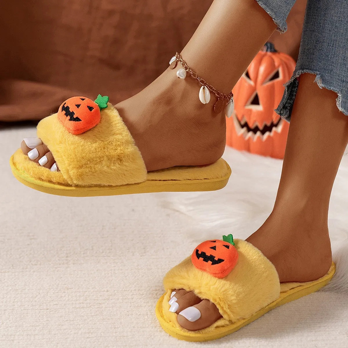 White and yellow Halloween pumpkin cartoon design open-toe plush slippers with synthetic fur.