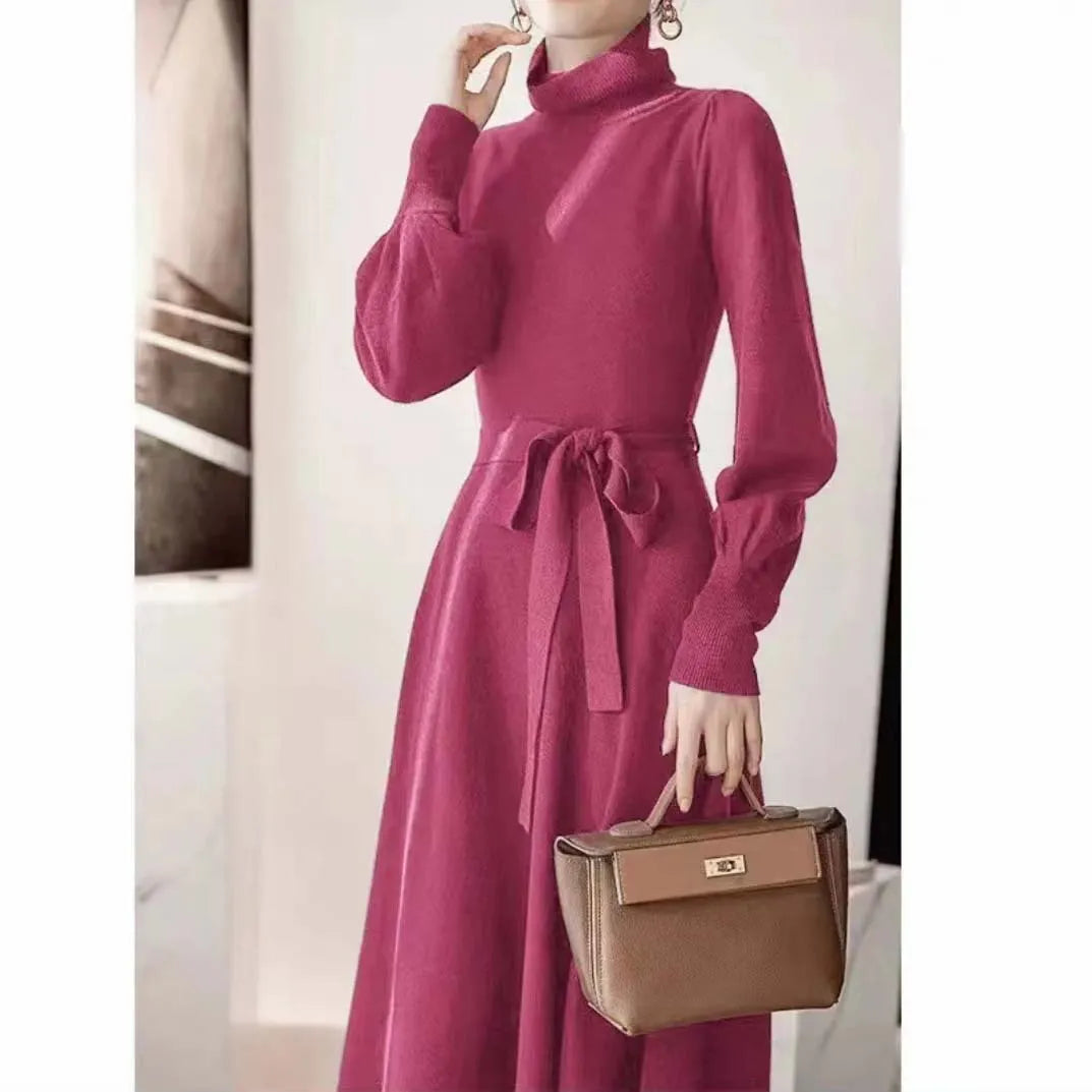 Women's turtleneck long sleeve knit dress in loose fit with big hem and elastic waist.