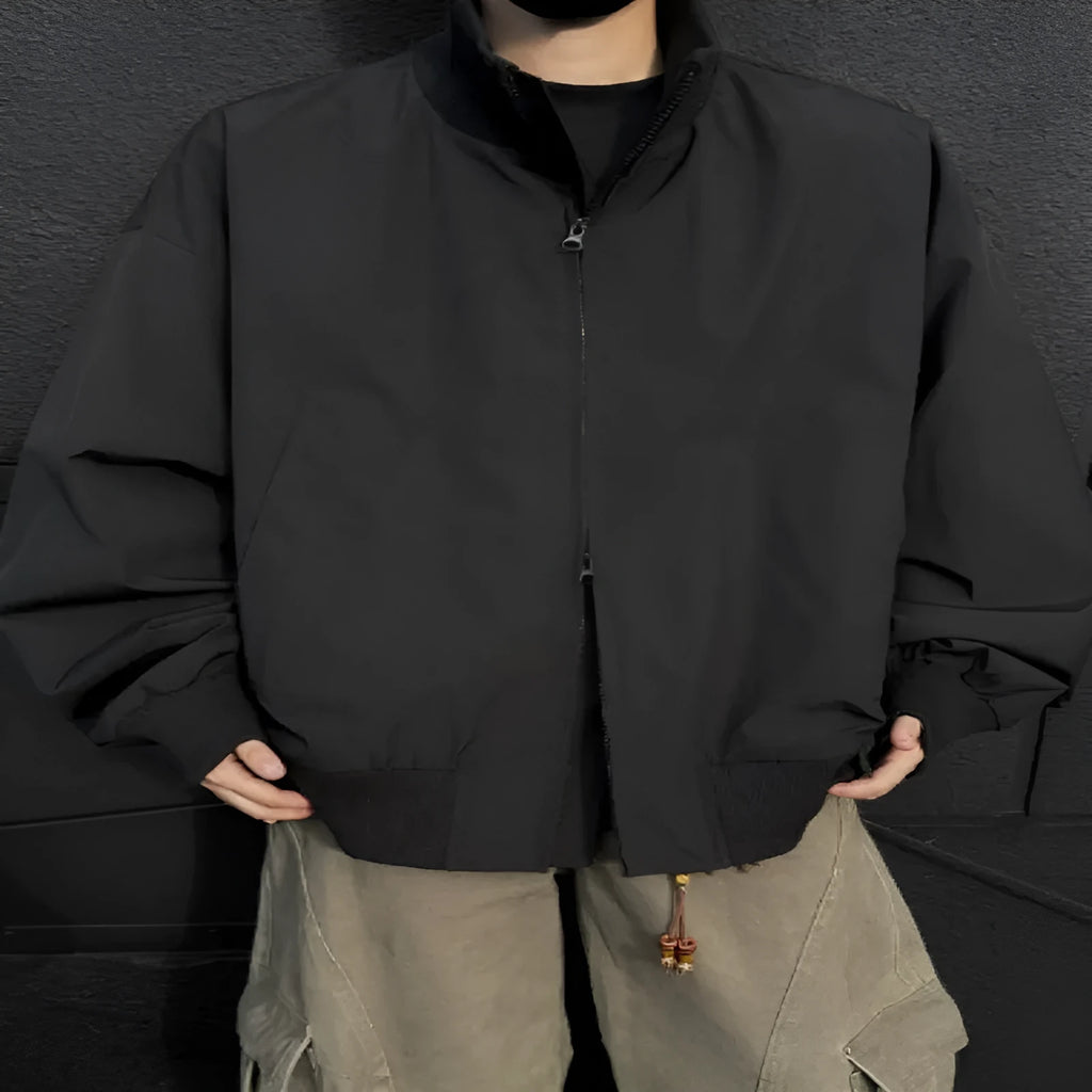 Men's cleanfit short jacket in solid colour polyester with side seam pockets, black colour option