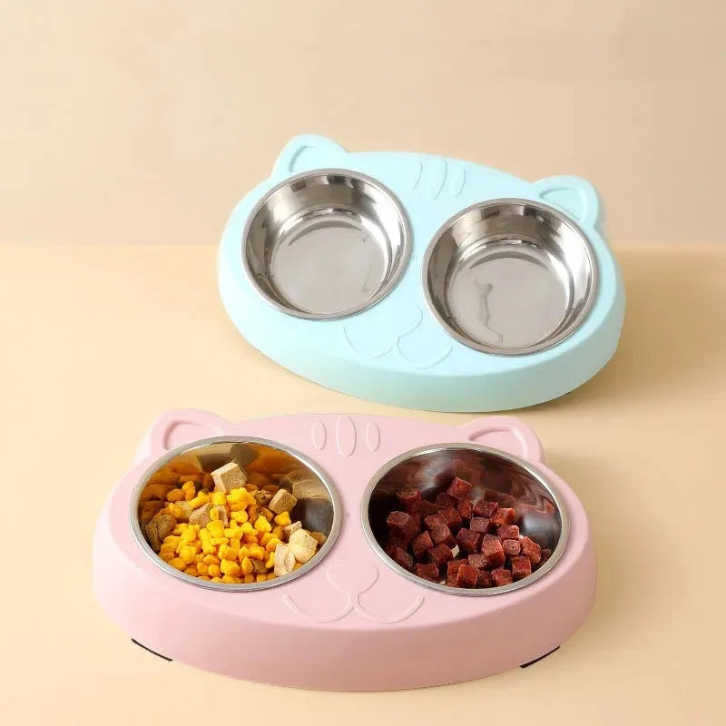 Blue macaron-shaped plastic pet feeding tray with two bowls for cats and small dogs on a white surface