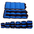Pair of Oxford cloth legging sandbag weights for athletic training, shown with ankle strap.