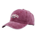 Retro peaked cap with distressed letter embroidery and adjustable sizing in conical crown design
