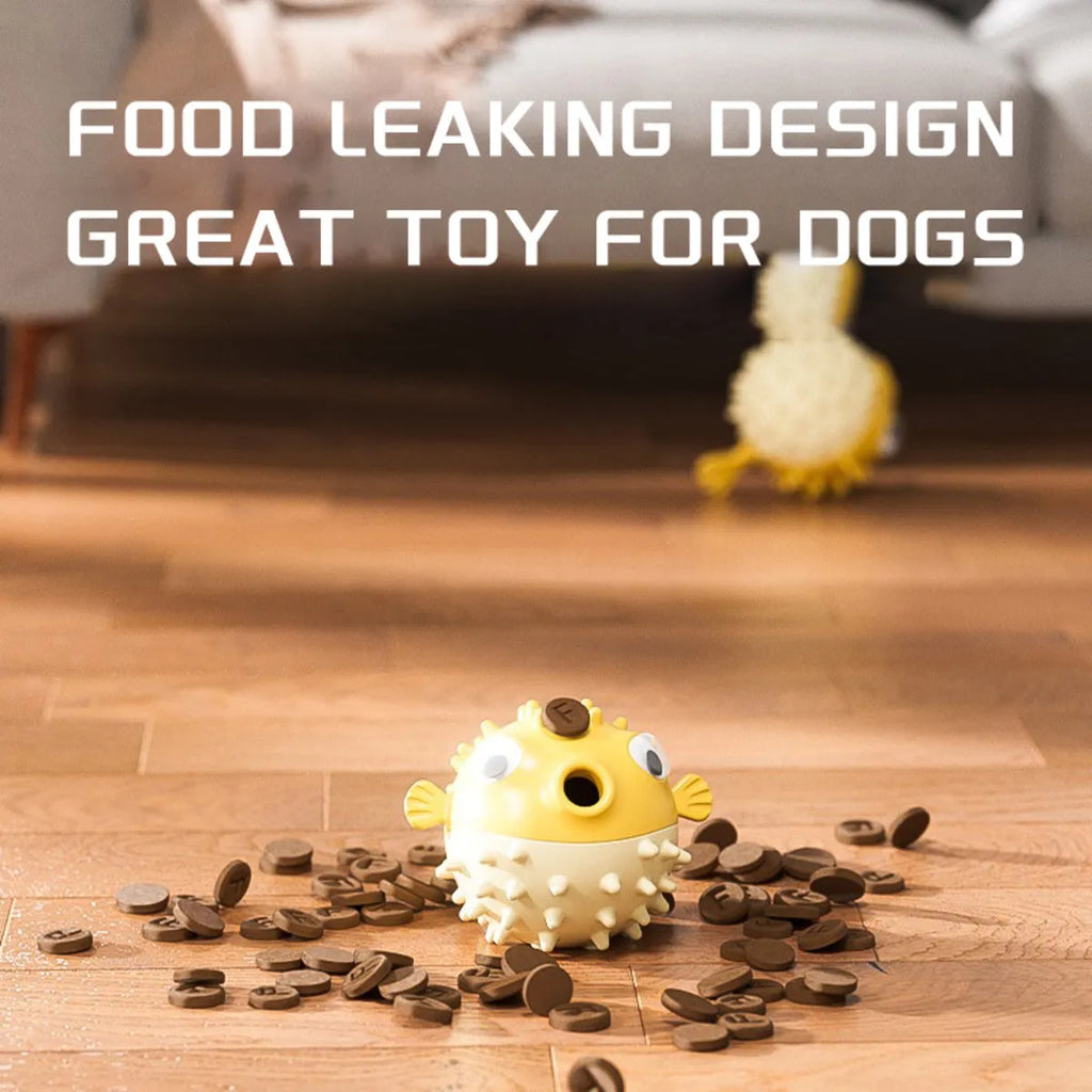 Yellow vinyl fish-shaped dog chew toy with textured surface and squeaker.