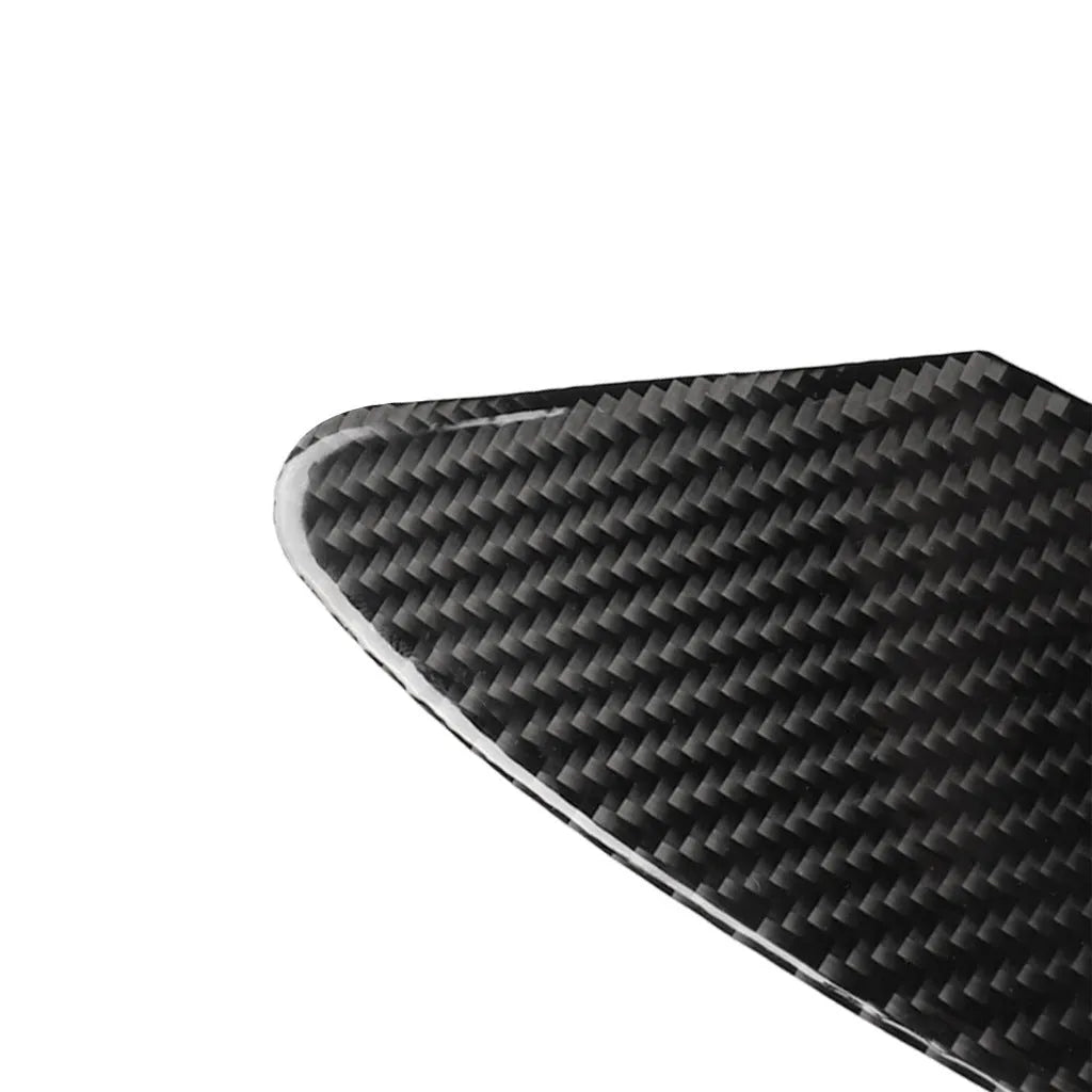 Carbon fibre decorative sticker panel for covering USB and charging ports on electronic devices.
