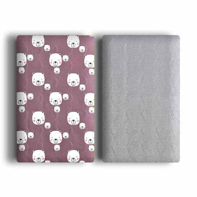 A soft cotton velvet pet blanket with a colourful dinosaur print, shown folded next to a dog bed.