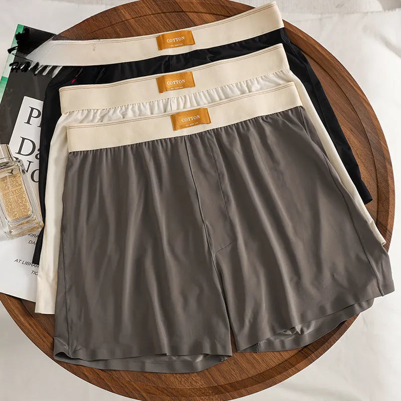 Men's ice silk boxer shorts in solid colours showing loose fit and mid waist design