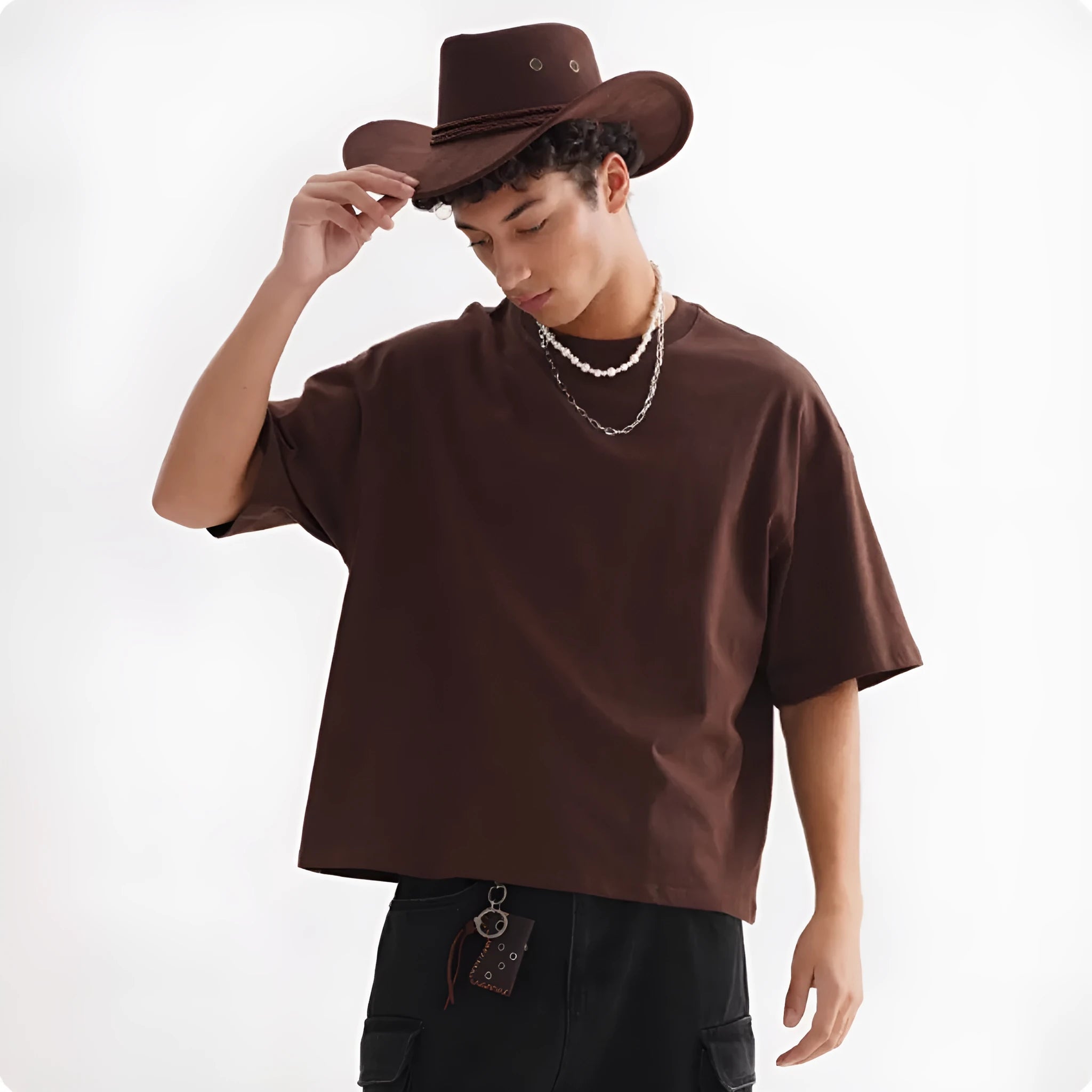 Man wearing a loose fit apricot coloured pure cotton t-shirt, short sleeves, casual American style.