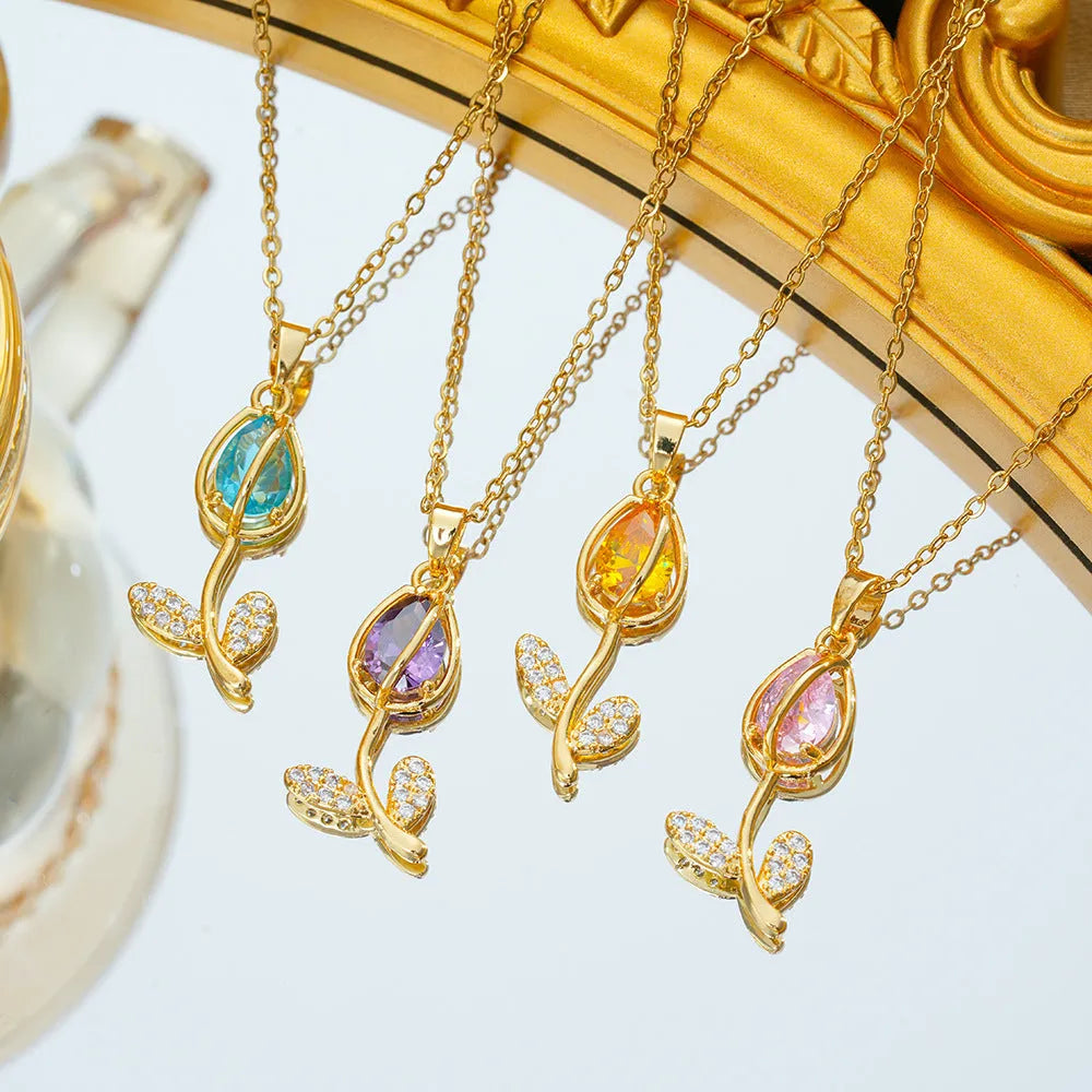 Gold zircon tulip flower pendant necklace on an adjustable titanium steel chain.