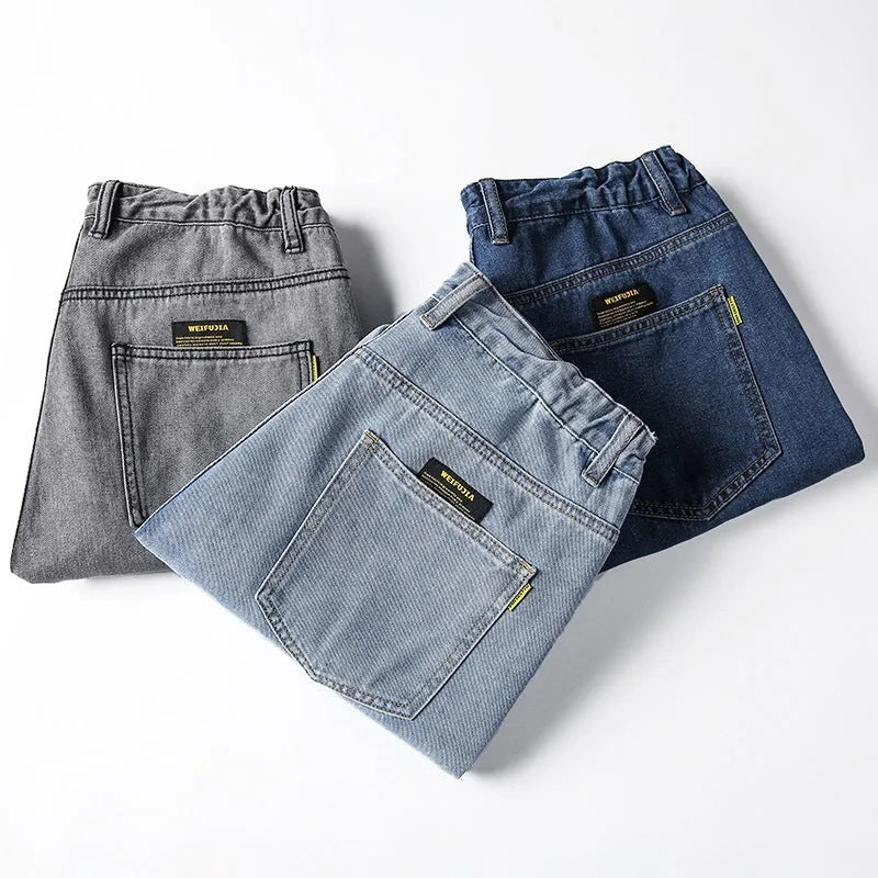 Men's loose straight cotton jeans in dark blue, light blue, and grey colours with mid-rise waist