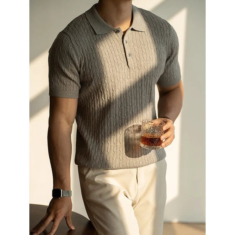 Men's khaki short sleeve business top on a hanger, showing the fabric texture and fit.