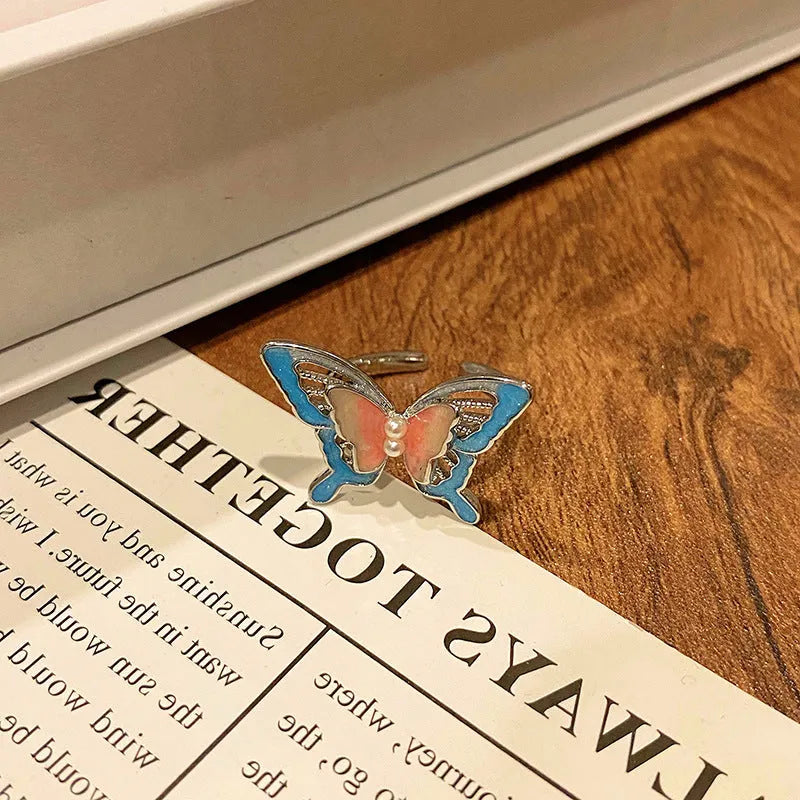 Butterfly design copper ring with oil-drip textured finish in women's jewellery