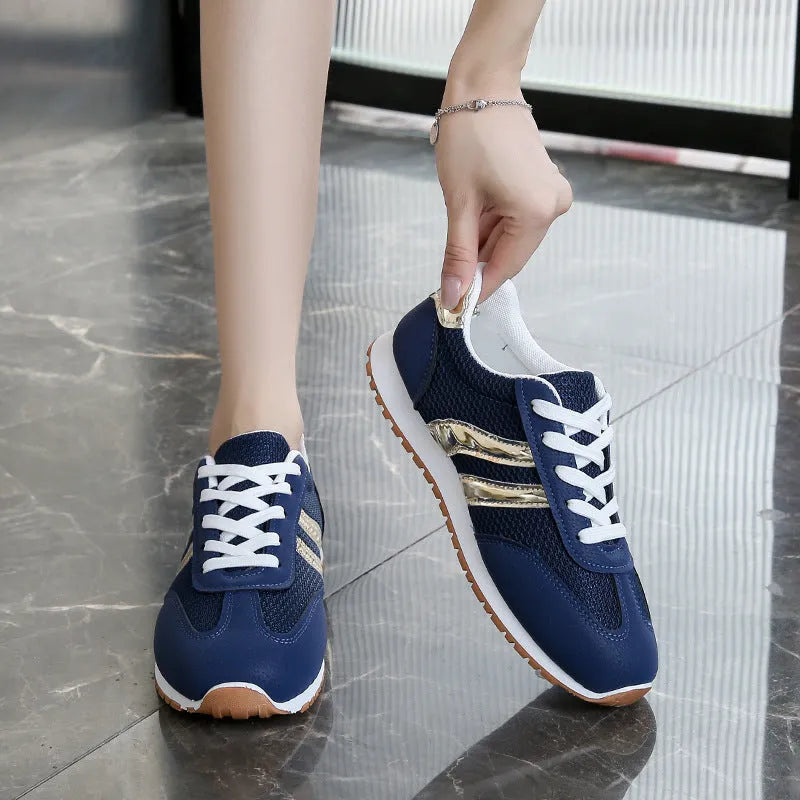 Blue women's casual tennis shoes with cross shoulder straps and rubber soles