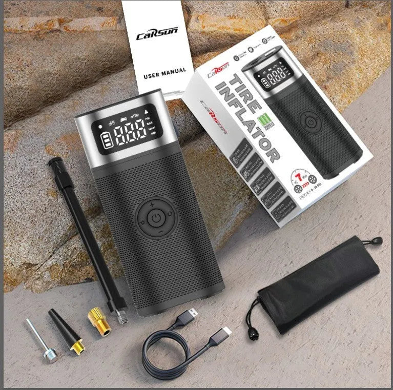 Black portable wireless air pump with 15cm tube, USB charging cable, and multiple nozzles for different inflation needs