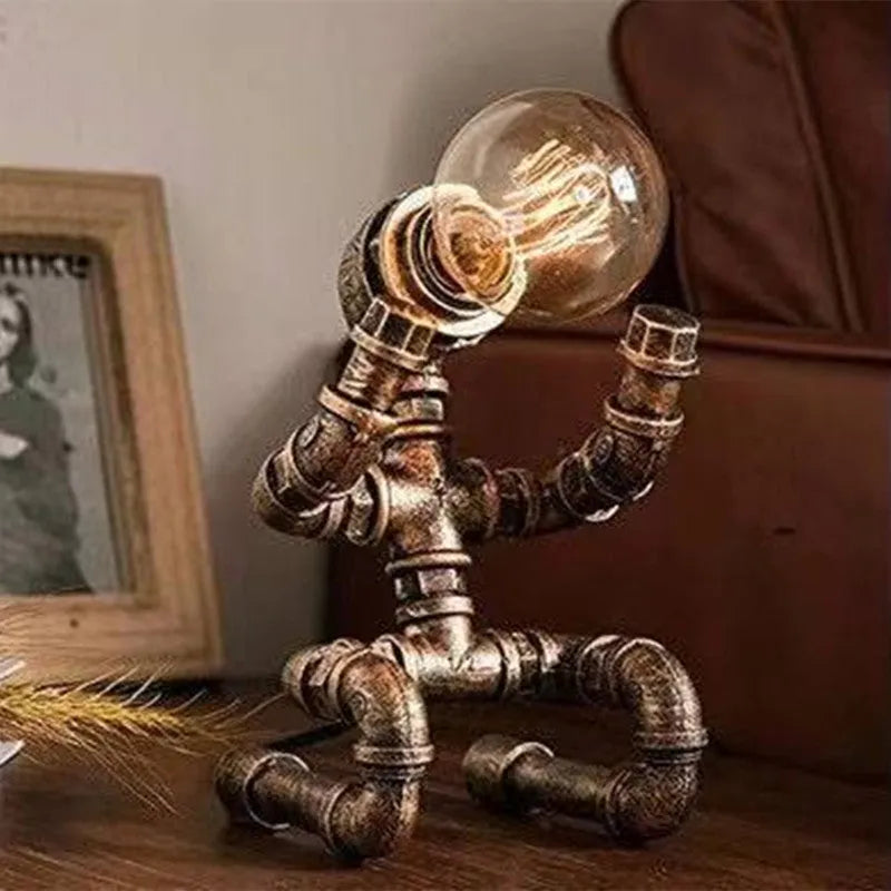 Industrial vintage table lamp constructed from iron water piping in a retro colour