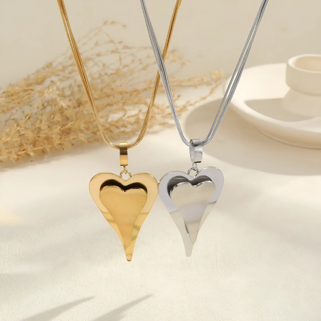 Stainless steel geometric snake bones chain necklace with double heart pendant in gold finish