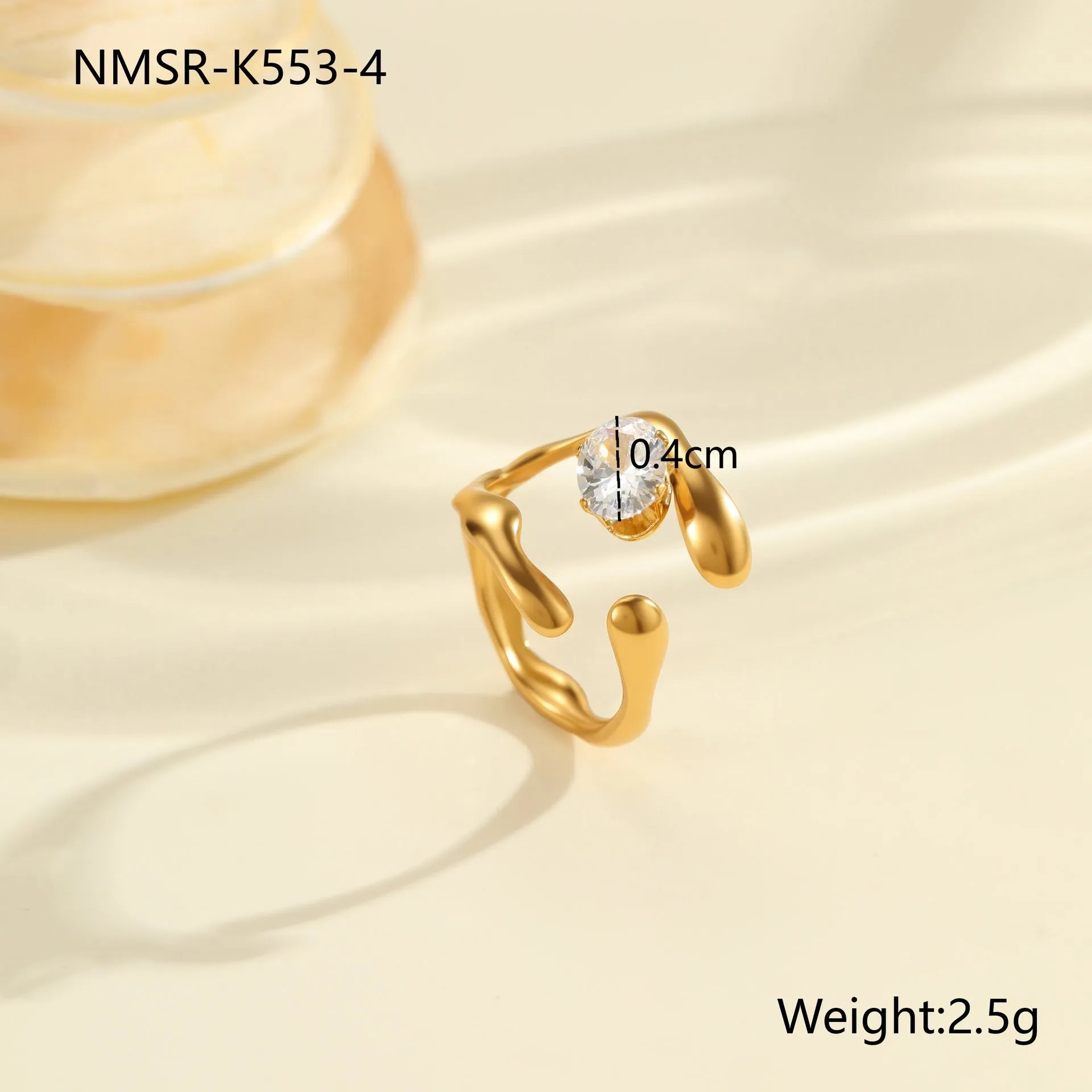 Women's geometric zircon ring with adjustable open mouth design on a hand.