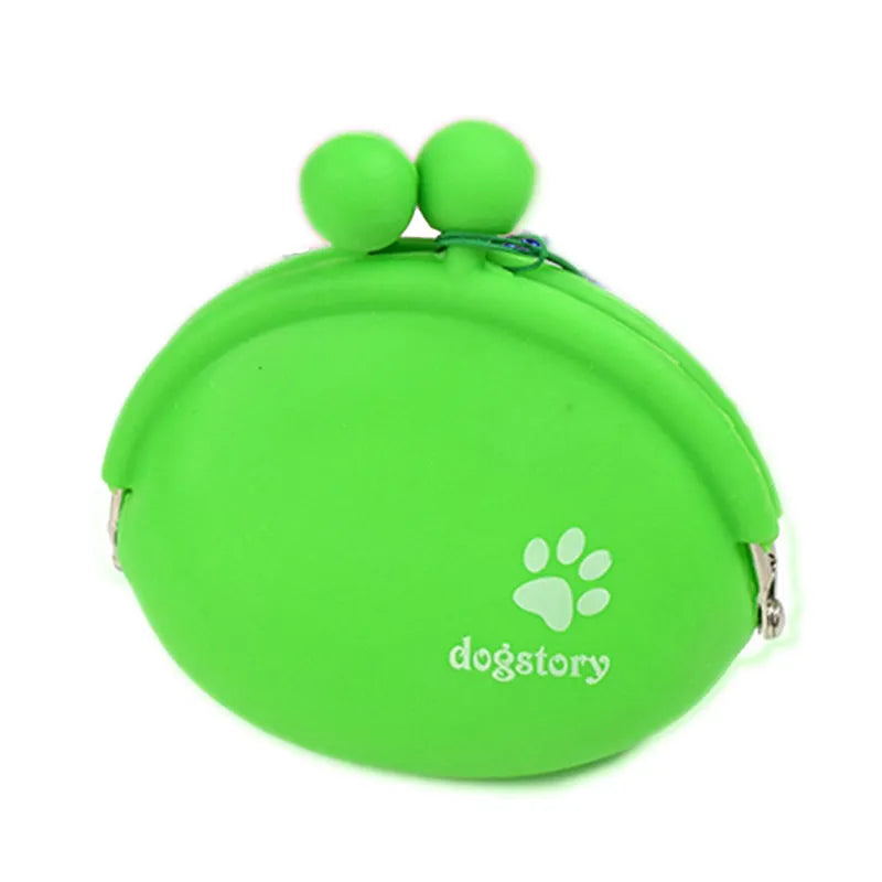 Yellow silicone pouch with hook-and-loop closure for dog treats, shown on a waistband.