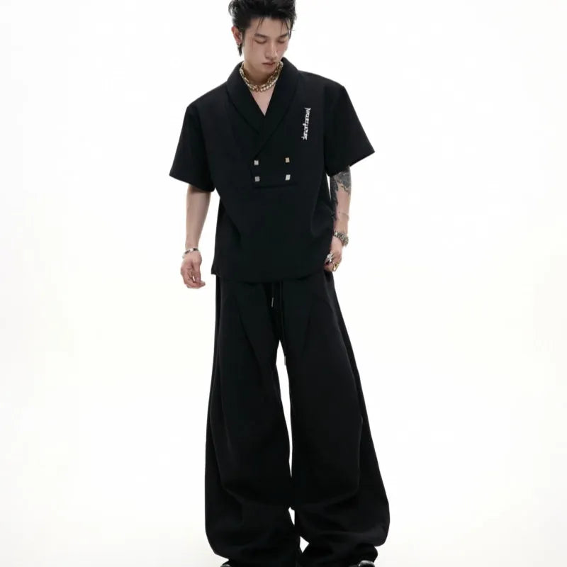 Men's dark grey cotton sports suit with V-neck jacket, padded shoulders, metal embellishments and matching shorts