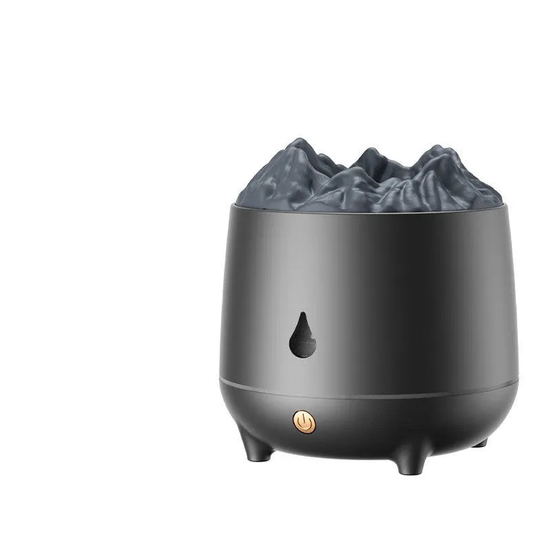 White volcano-shaped ultrasonic humidifier with USB cable on a wooden table.