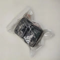 Black ABS plastic seat belt buckle clamp holder securing vehicle seat belt latch