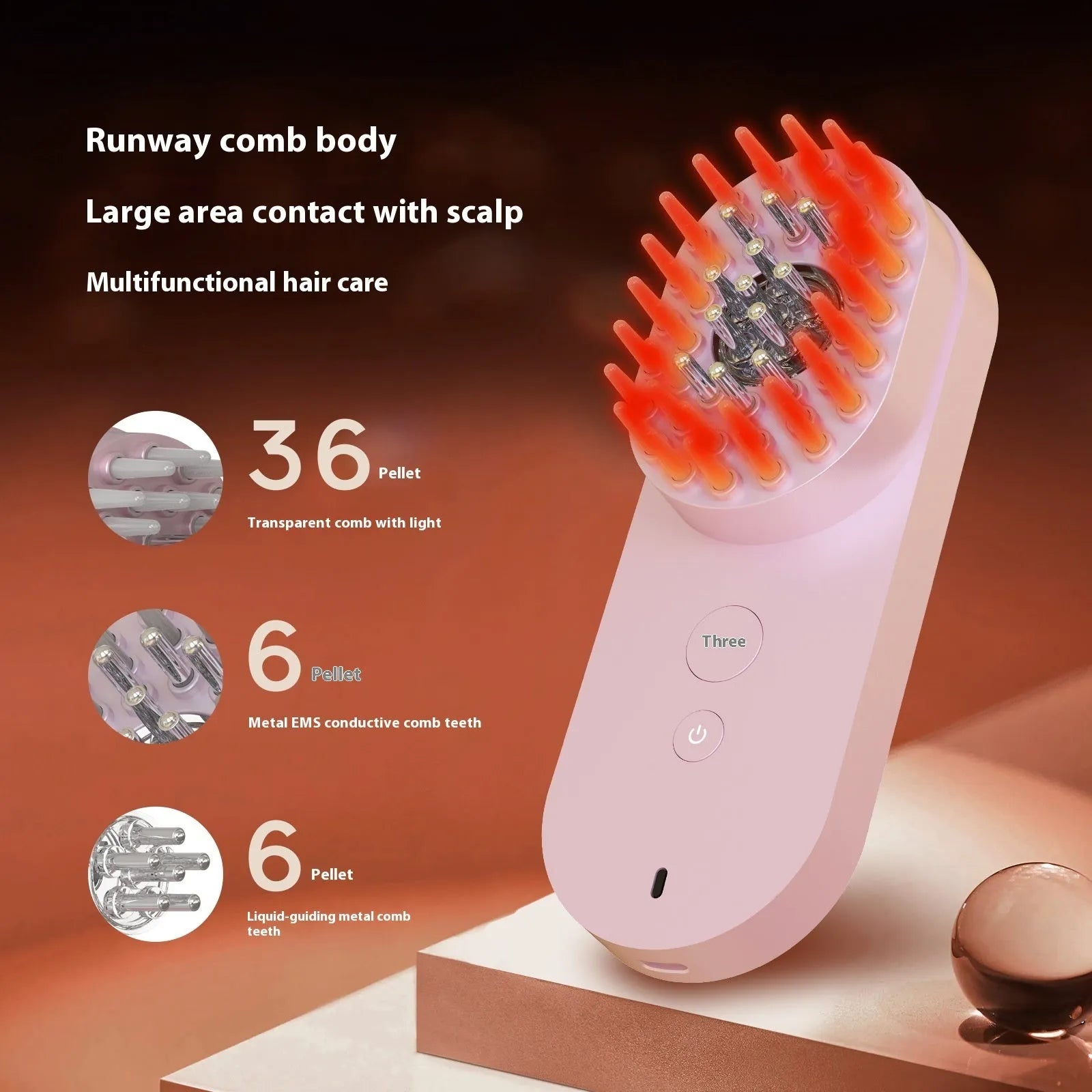 Smart massage comb with red light therapy function in pink colour option showing compact size