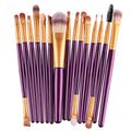 MAANGE 18 piece makeup brush set with fan-shaped cosmetic tools on a table.