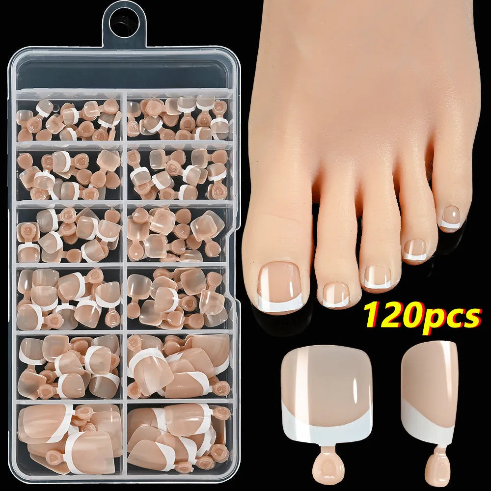 120-piece box of French white tip false toenails in nude colours, square short shape.